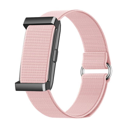 Pink screenless smart bracelet with ribbed fabric band and black rectangular module