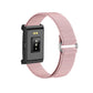 Pink smart bracelet underside showing sensor module and ribbed fabric band