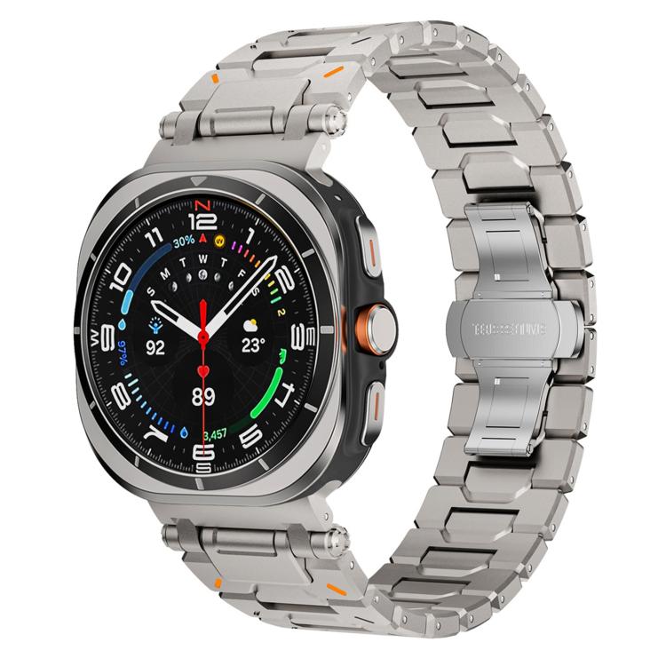 Silver titanium alloy watch band with butterfly clasp fitted to a round smartwatch