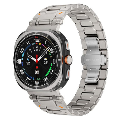 Silver titanium alloy watch band with butterfly clasp fitted to a round smartwatch