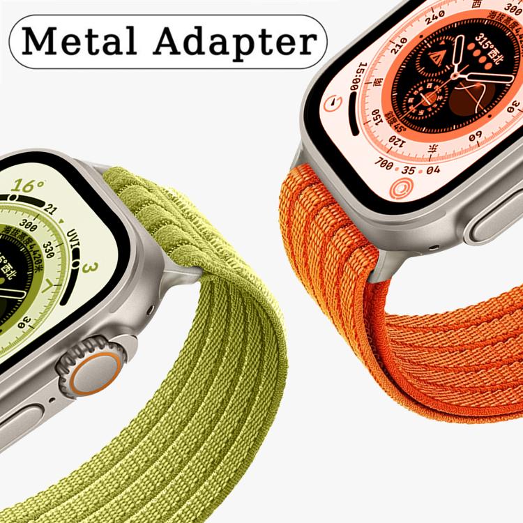 Woven nylon Apple Watch band with metal adapters in orange and green