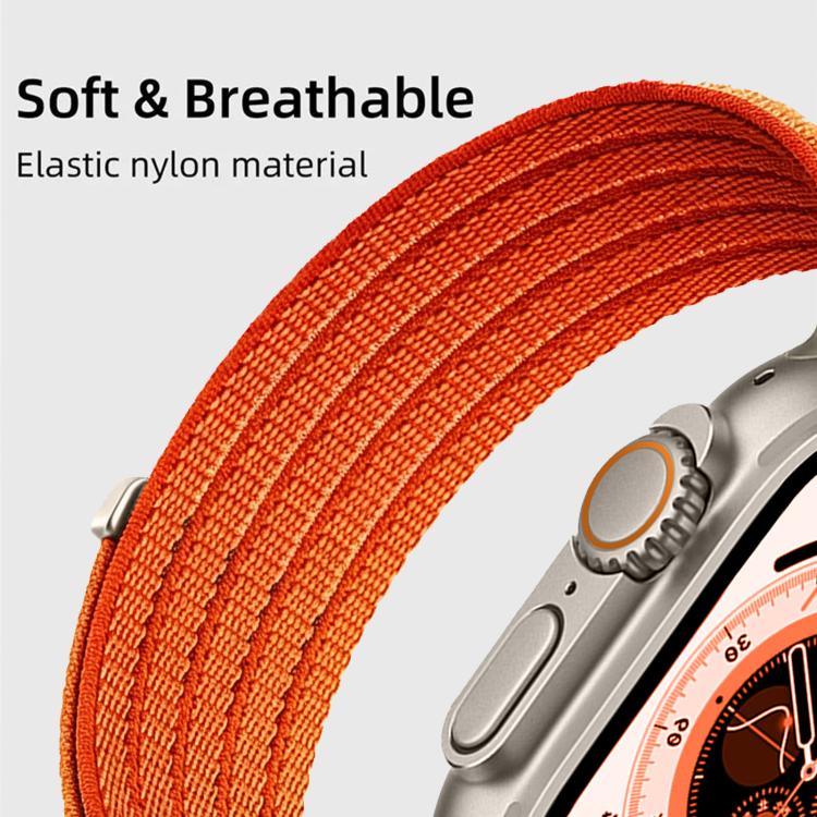 Close-up of orange woven nylon Apple Watch band and metal adapter