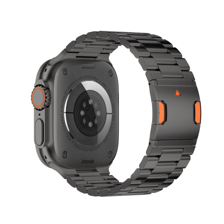 Back view of a smartwatch with a dark three-bead metal band and magnetic clasp