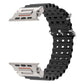 Black perforated silicone watch band with silver-tone metal connectors, shown unfastened.