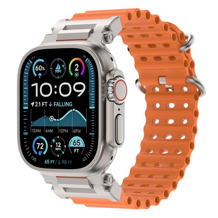 Orange perforated silicone watch band with metal connectors on a compatible watch.