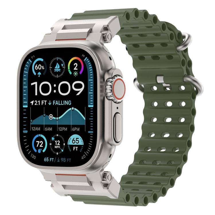 Army green perforated silicone watch band with metal connectors on a compatible watch.