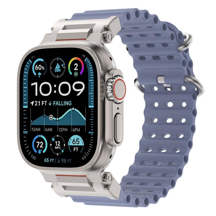 Blue perforated silicone watch band with metal connectors on a compatible watch.