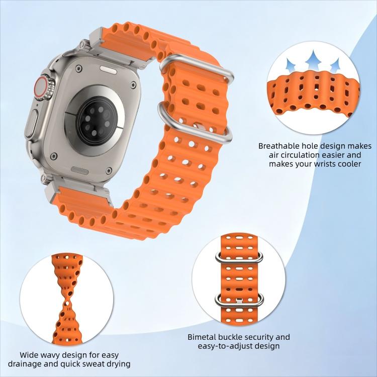 Orange silicone watch band attached to a smartwatch, with perforations and metal buckle