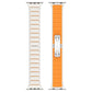 Two-sided watch band view showing silver links, orange silicone inlay, and folding buckle