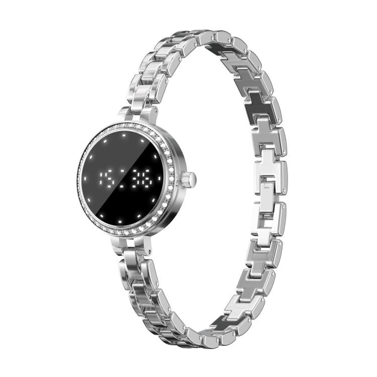 Silver smart bracelet with a round black display, crystal-set bezel, and linked metal band