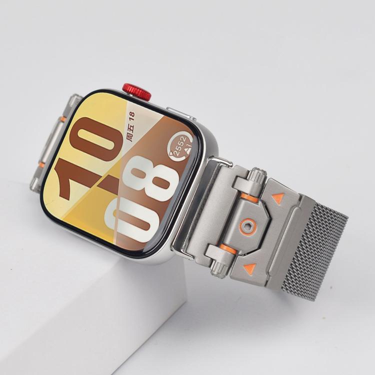Close-up of a silver Milanese watch band connector with orange accents