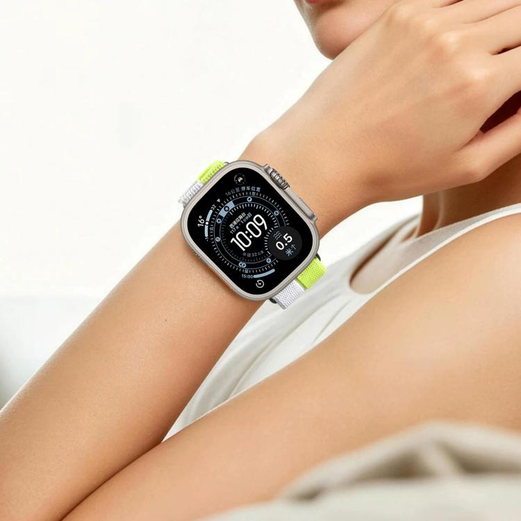 Lime green and white nylon loop watch band worn on the wrist