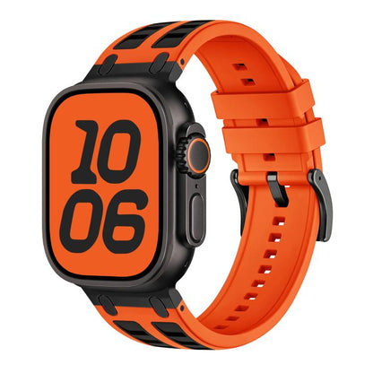 Orange silicone Apple Watch band with black accents, shown fitted to a watch