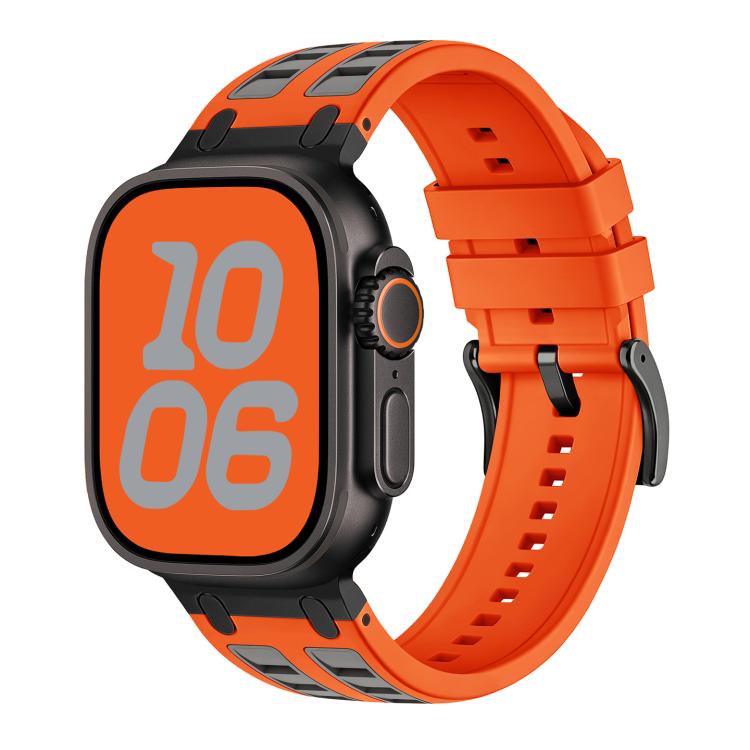 Orange silicone Apple Watch band with gray accents, shown fitted to a watch