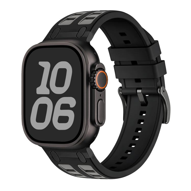 Black silicone Apple Watch band with gray accents, shown fitted to a watch