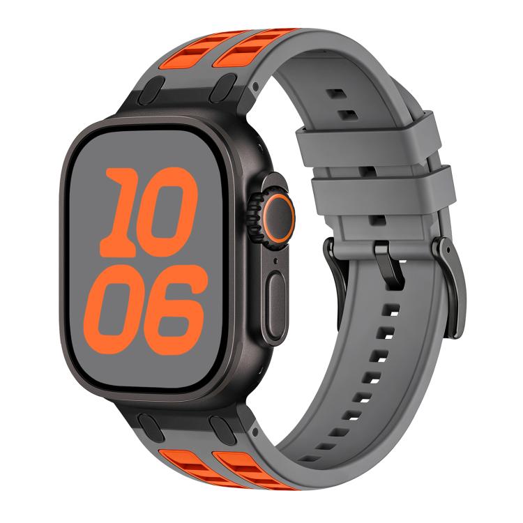 Gray silicone Apple Watch band with orange accents, shown fitted to a watch