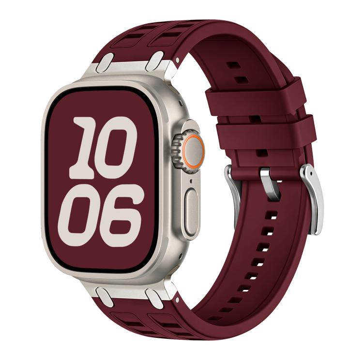 Burgundy silicone watch band with light-colored accents, shown fitted on a watch