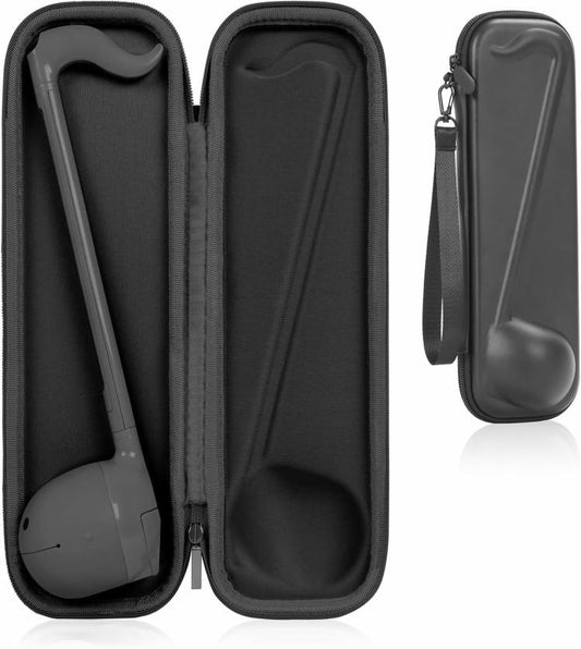 Black hard-shell instrument carrying case with two molded compartments and zipper closure