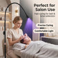 Black floor UV LED curing lamp with glowing bulb near client during lash treatment