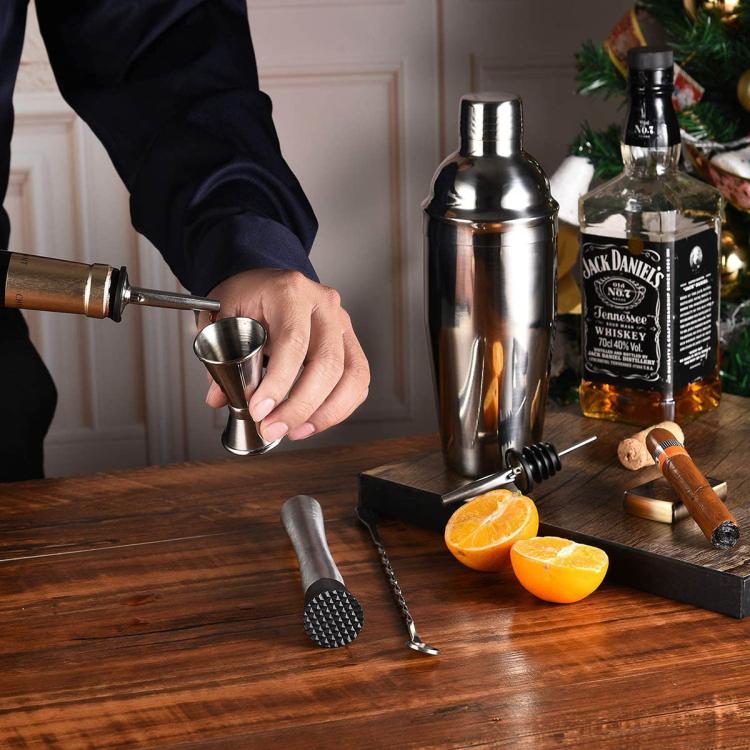 Stainless steel cocktail shaker set with jigger, bar spoon, and muddler for cocktails