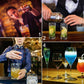 Stainless steel cocktail shaker pouring mixed drinks into cocktail glasses