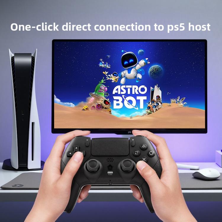Black game controller held in hands with textured grips and button layout