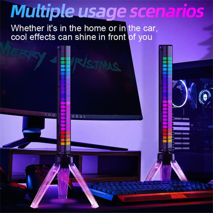 RGB pickup lamp on clear tripod beside a monitor and keyboard, vertical rainbow LED bar