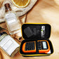 Black label maker storage bag opened with label maker, keyboard pad, and screen accessory