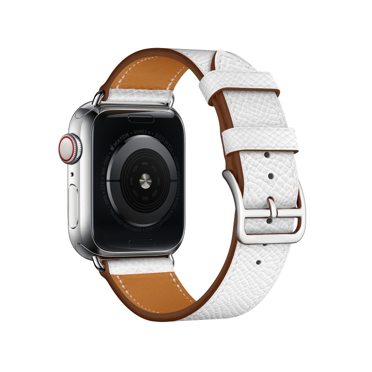 White leather Apple Watch cross-band strap with silver buckle and tan underside