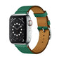 Green leather Apple Watch cross-band strap with tan inner backing and buckle holes