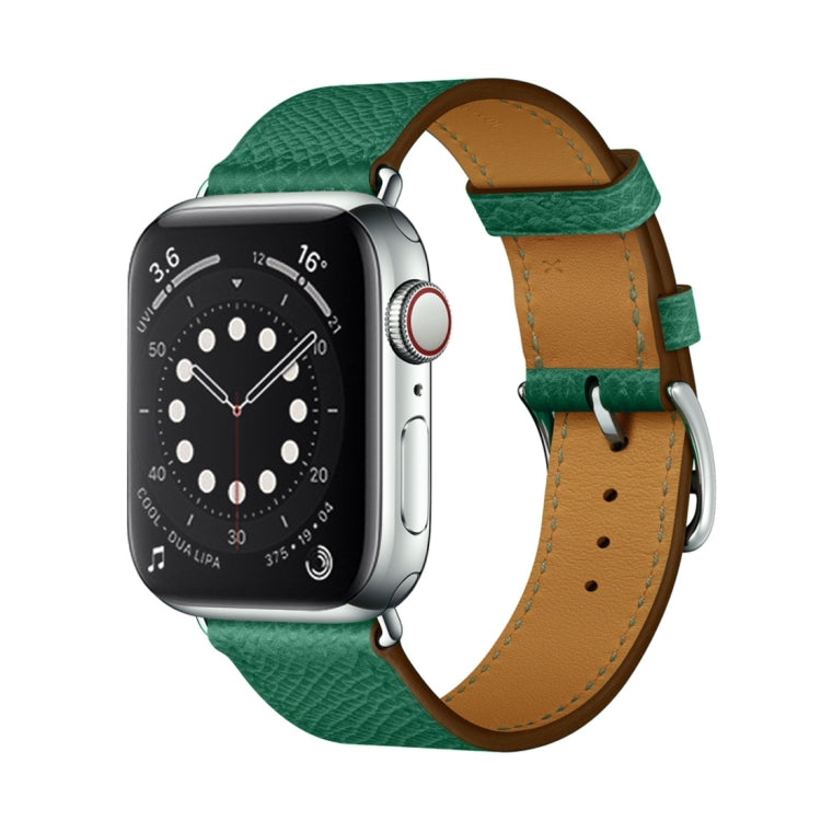 Green leather Apple Watch cross-band strap with tan inner backing and buckle holes