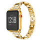 Smartwatch with gold X-shaped metal link strap and red side button detail