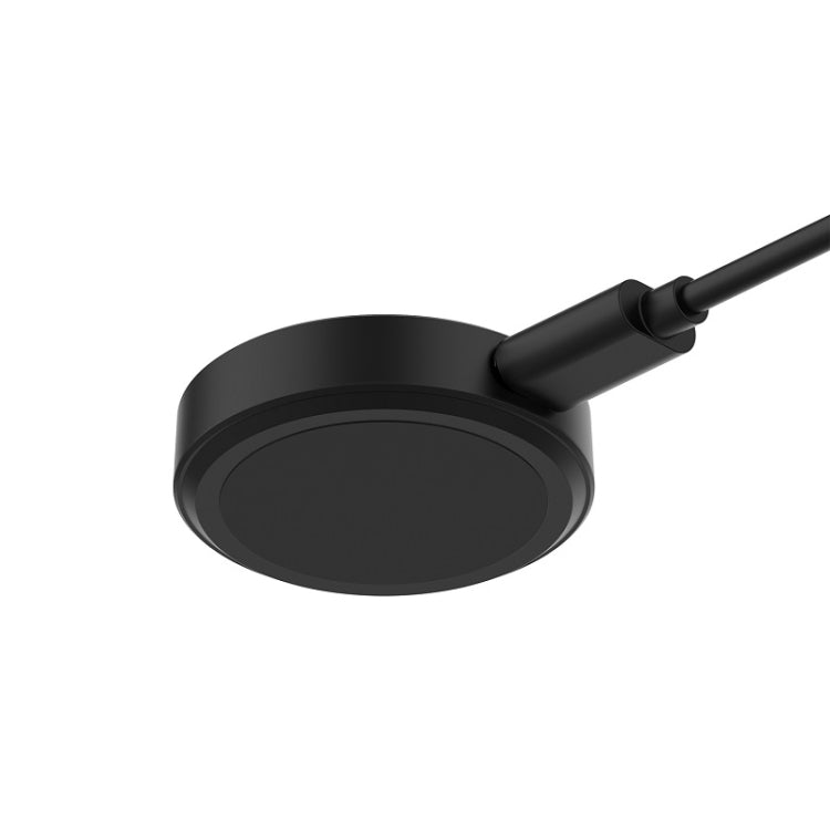 Black round magnetic charging pad with connector and attached cable