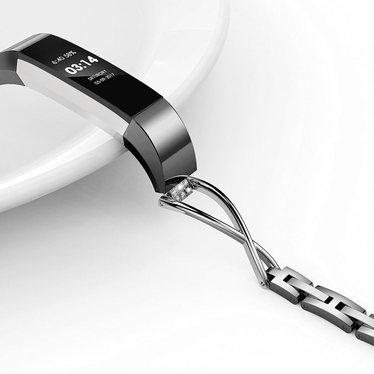 Silver metal watch strap with black display panel and clear gemstone accents