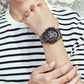 OCHSTIN men’s multi-function wristwatch with dark dial, subdials, and steel link strap