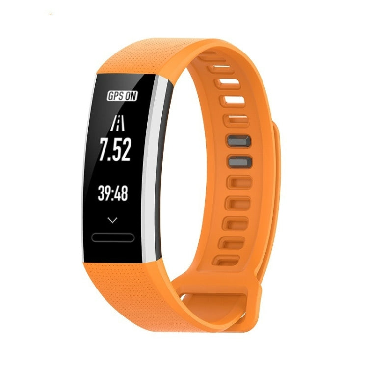 Orange silicone sports watch strap with perforated texture and adjustable holes