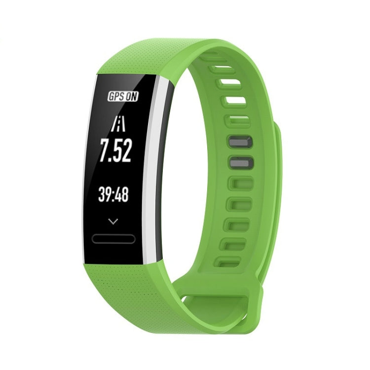 Green silicone sports watch strap with perforated texture and adjustable holes