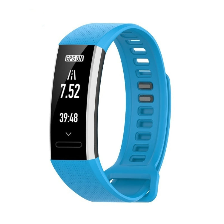 Blue silicone sports watch strap with perforated texture and adjustable holes