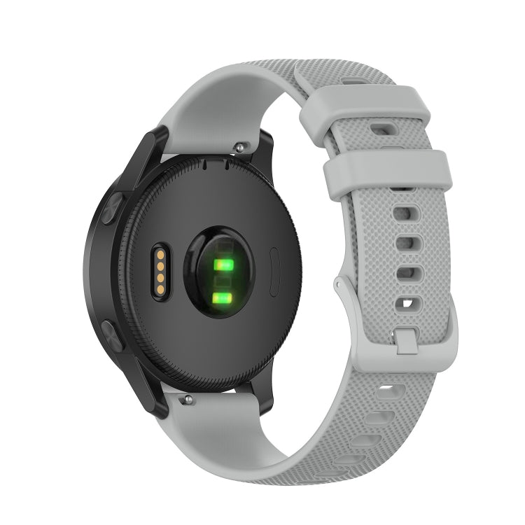 Light gray silicone smartwatch strap with perforated texture and buckle, adjustment holes