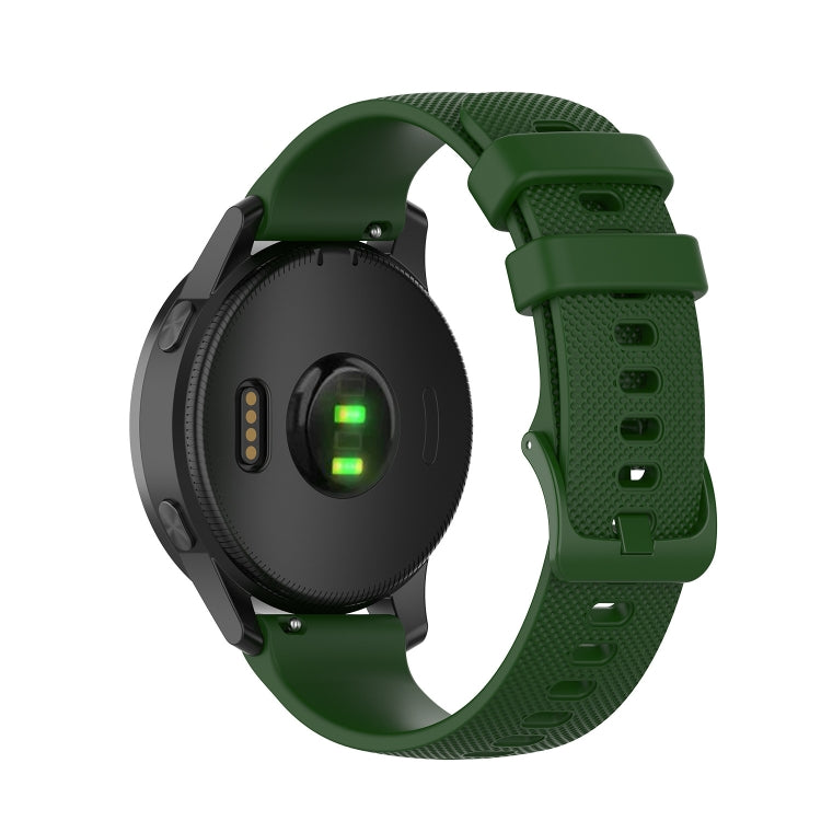 Silicone watch strap in dark green with textured holes and secure pin buckle
