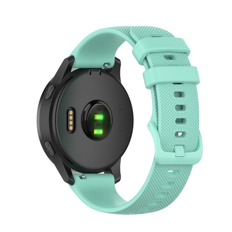 Silicone watch strap in teal green with textured holes and rectangular clasp