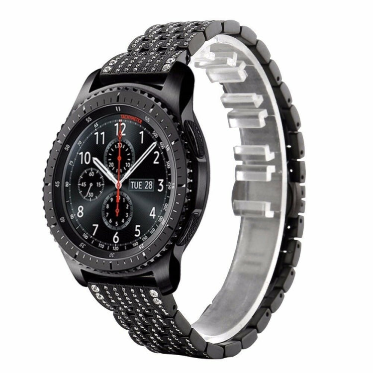 Black metal watch strap with textured links and rhinestone-detailed top