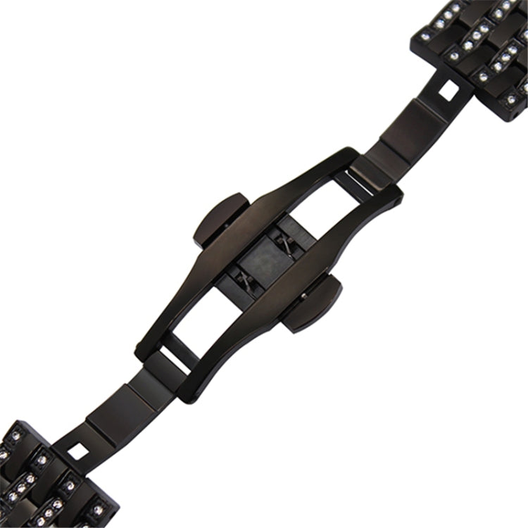 Black metal watch strap with perforated center links and buckle section