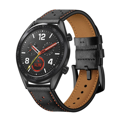 Black leather watch strap with orange stitching and perforations, tan underside.