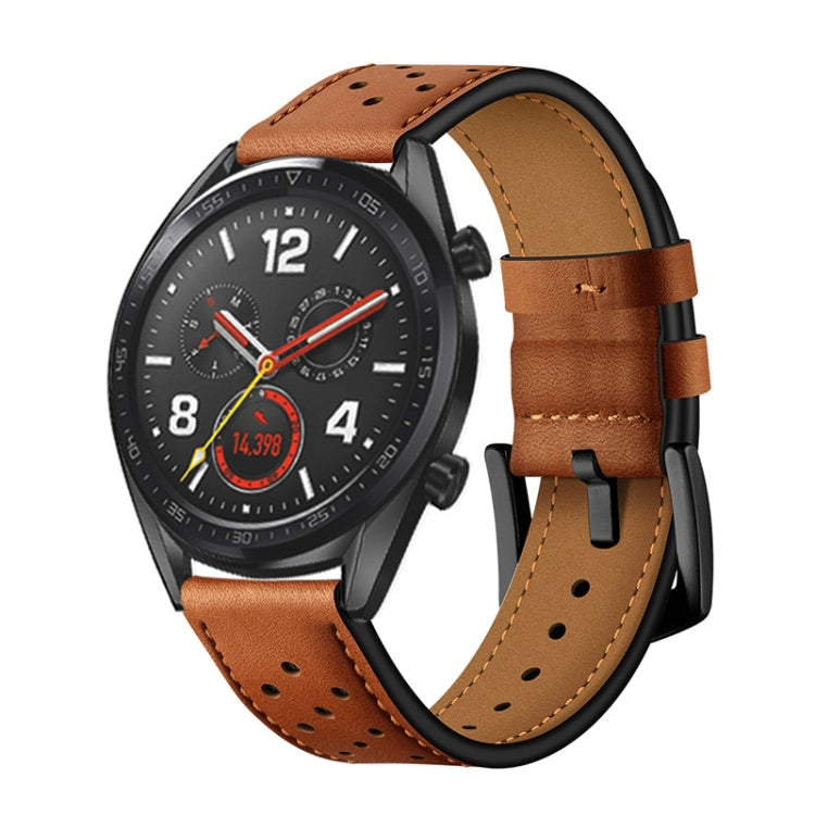 Brown leather watch strap with perforated holes, tan lining, and metal buckle.