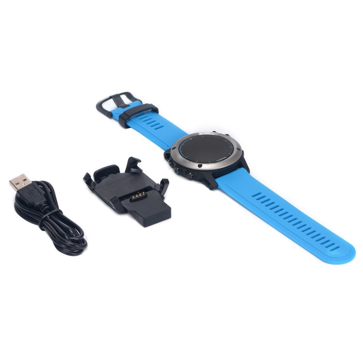Garmin watch charging kit with blue watch band, dock, USB cable, and power adapter