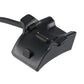Black charging cradle with gold contact pins and cable loop
