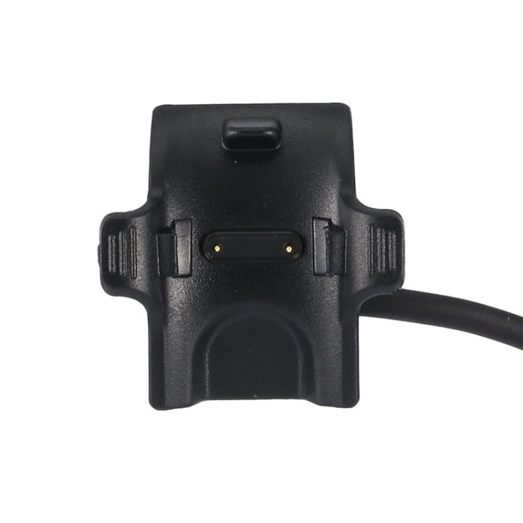 Black charger clip with central opening and attached cable