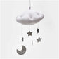 White plush cloud ceiling mobile with dark gray moon and star hanging charms