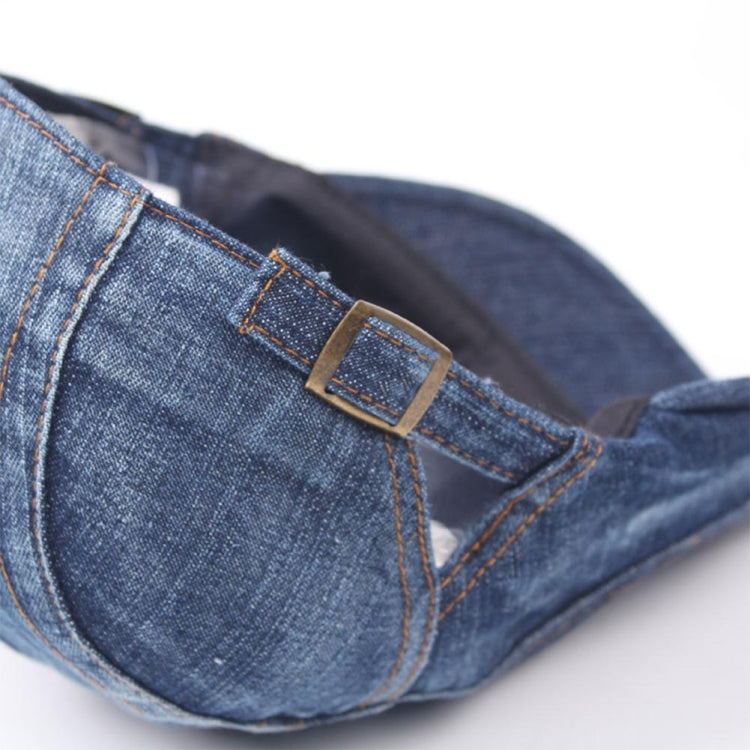 Washed denim beret close-up of adjustable buckle and topstitching on brim